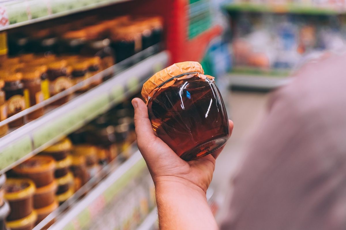  a glass jar of honey