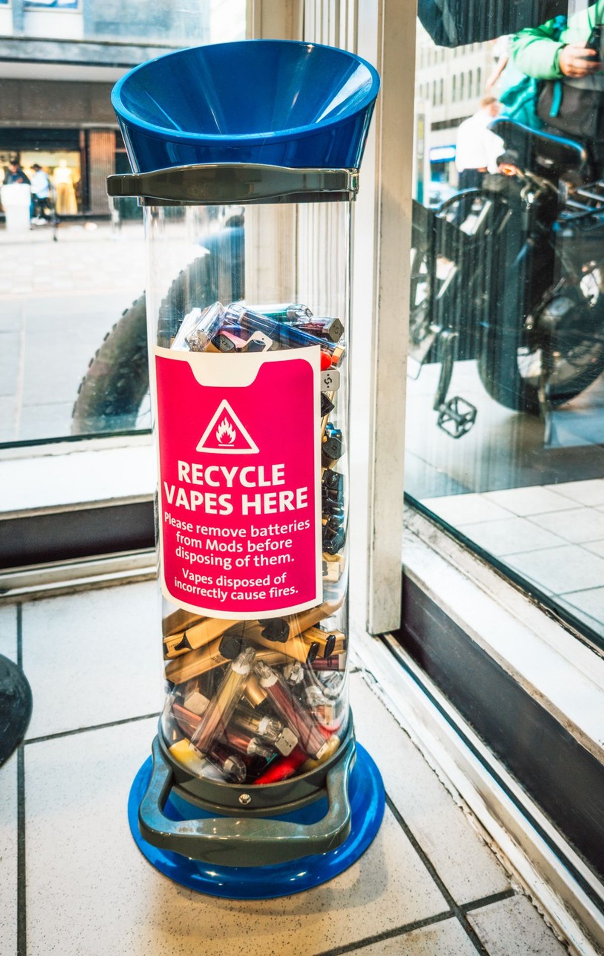 A high street collection bin of single-use vapes for recycling and safety.