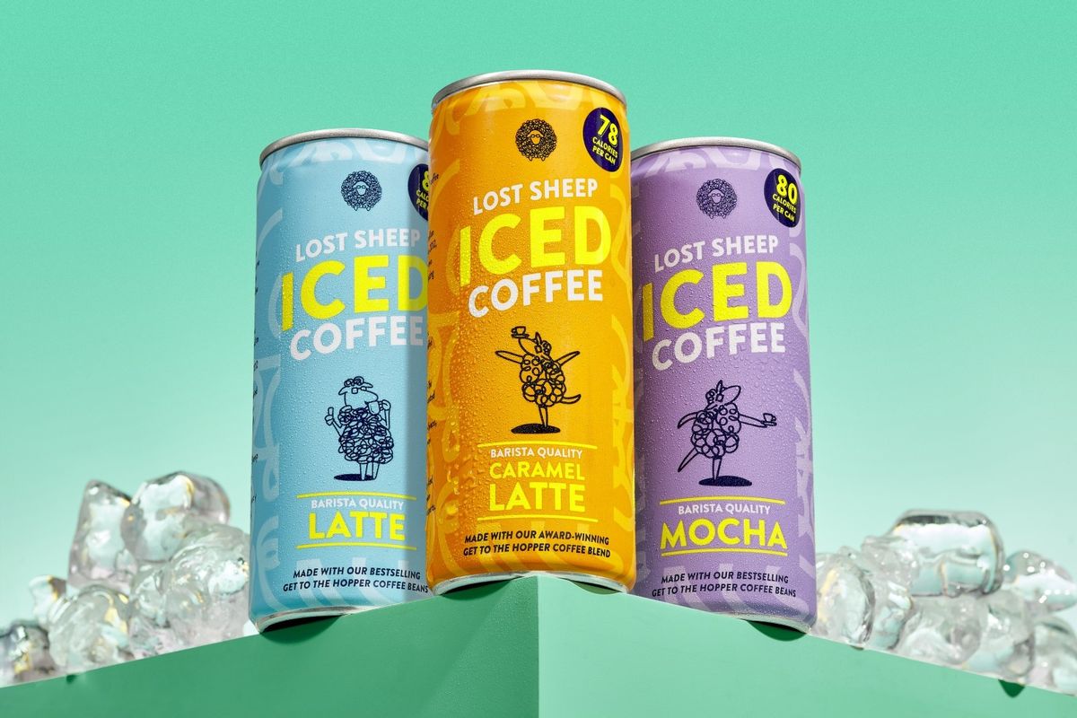 A sleek can of Lost Sheep Coffee’s Iced Caramel Latte on a café table, showcasing its 2025 specialty-grade, traceable RTD range.  