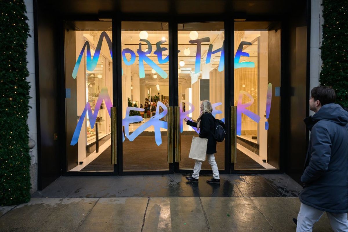 A woman enters the Selfridges department store