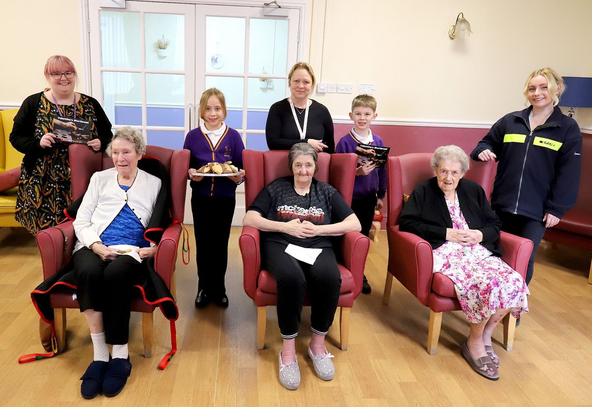 Ashton Primary students bake Valentine’s shortbread for residents.