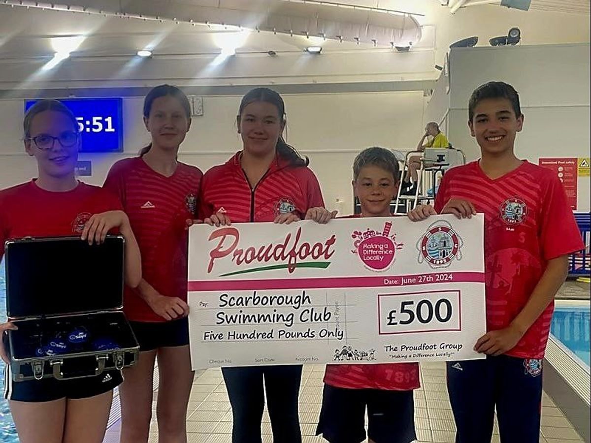 Proudfoot Group makes donation to swimming club through Nisa's charity