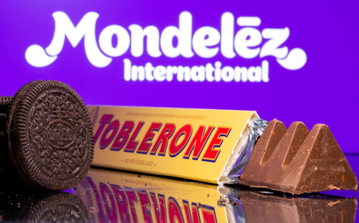 Oreo biscuits and a Toblerone Swiss milk chocolate are seen displayed in front of Mondelez International logo 