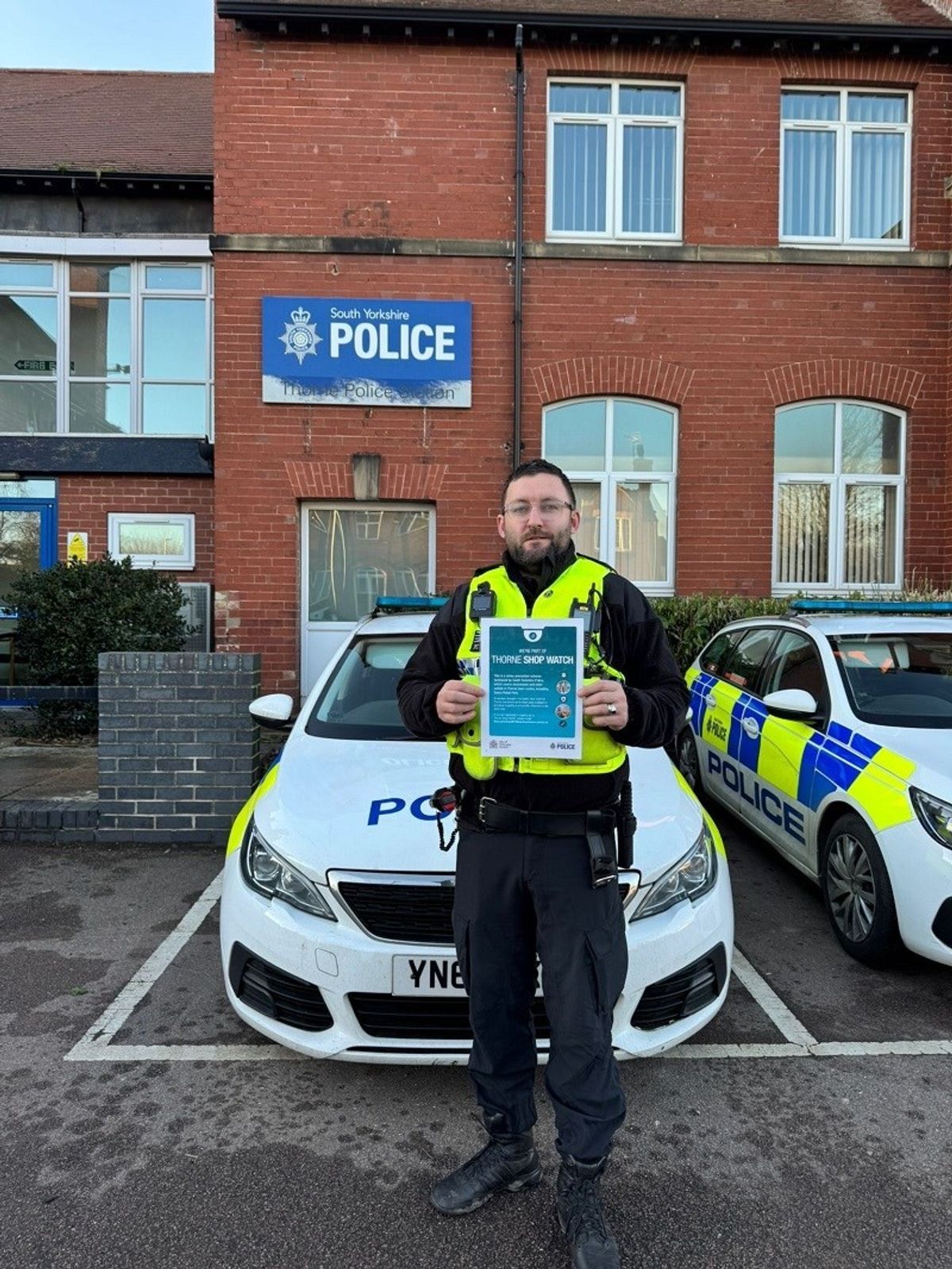 PC John Sharp with the Thorne Shop Watch poster