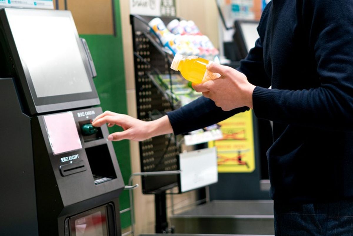 Self-checkout tills at UK grocery store