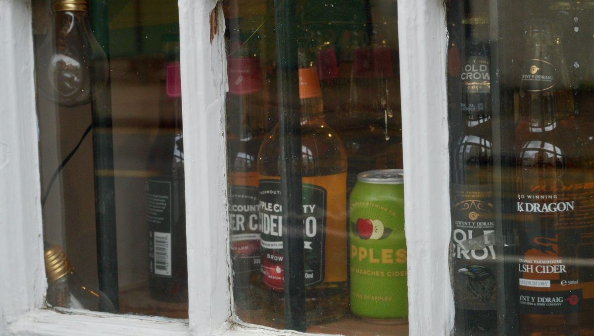 Shop window in Crickhowell high street selling a range of locally produced alcoholic drinks