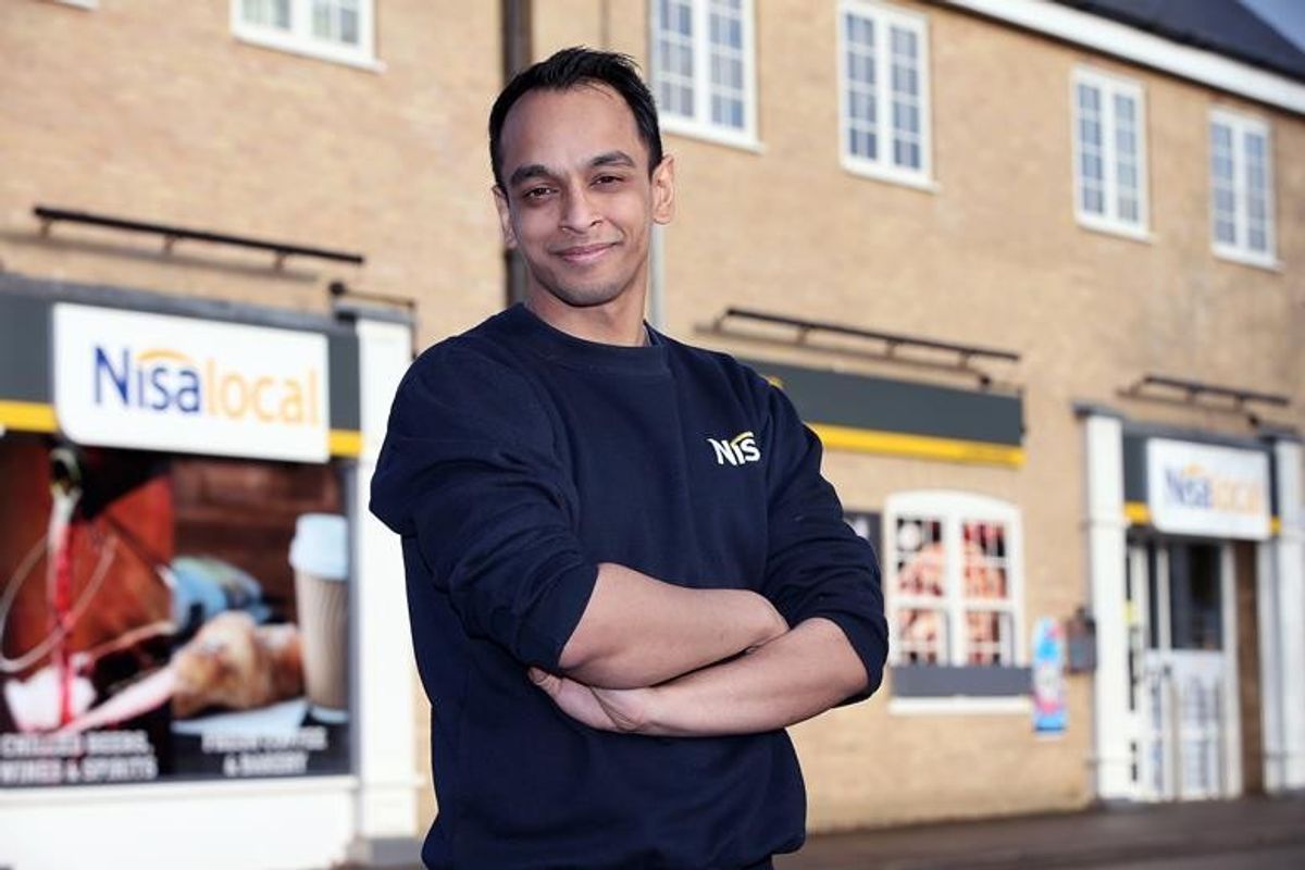 Store staff assisting customers, highlighting strong community ties