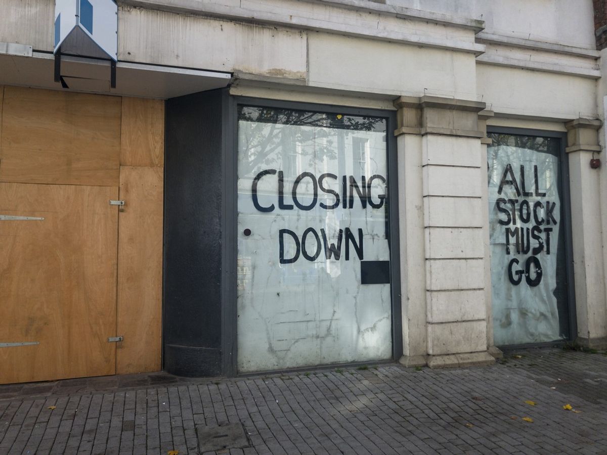 UK high street with vacant retail stores due to job losses